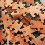 A picture of jigsaw puzzles scattered about